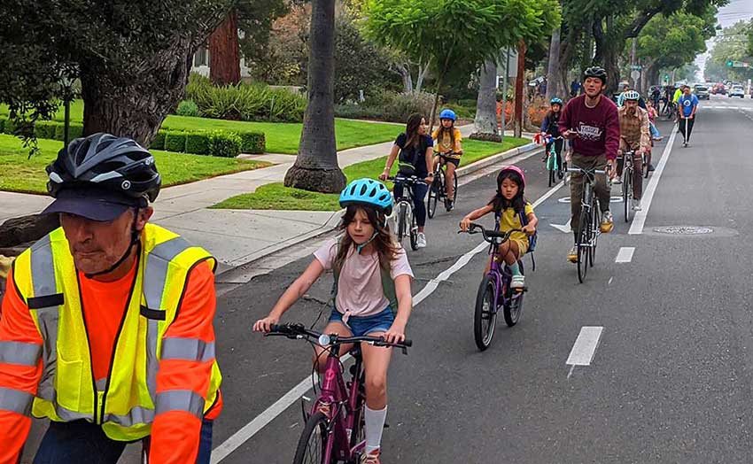 Kids and dults biking to school