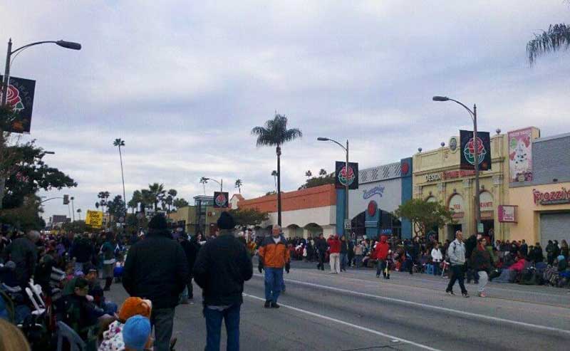 People lining up on street waiting for floats