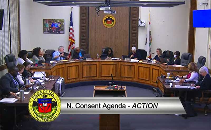 A group of people meeting in a board room