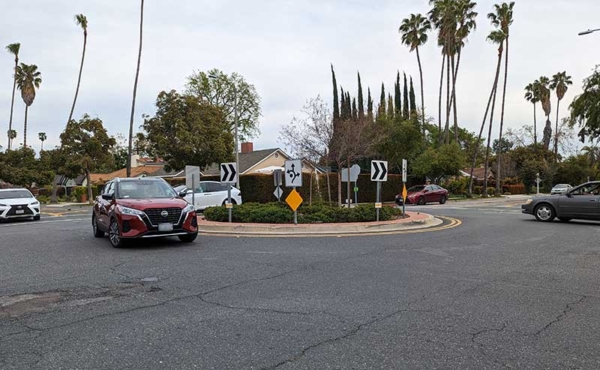 A roundabout with 3 stop signs
