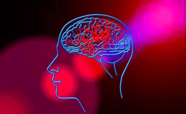 A drawing of a head and a beam of light going through it