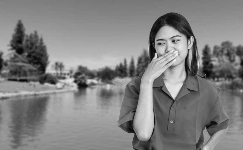 a woman holding her nose