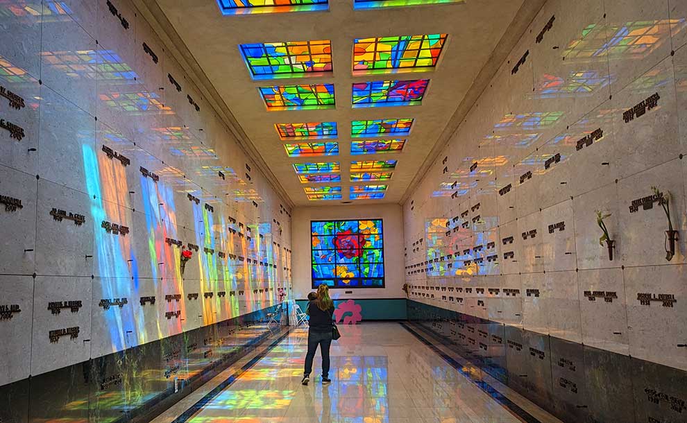 a person with a child at a mausoleum