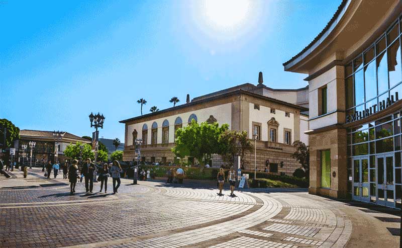 people walking by an open space