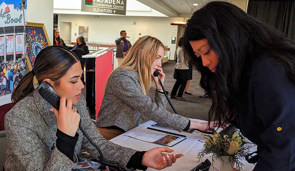 a woman talking to a girl on the phone