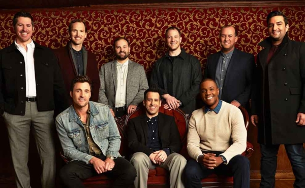 group of musicians smiling