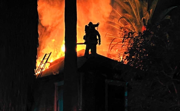 A firefighter on roof