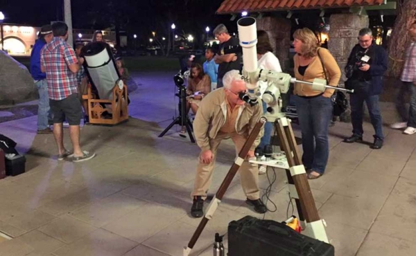 people watching stars in a parking lot