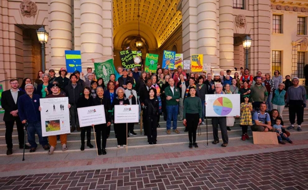people gathering in front of City Hall