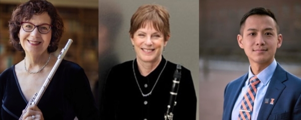 Three people smiling and holding instruments