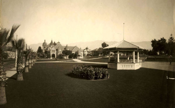 an old building with a big lawn in front of it