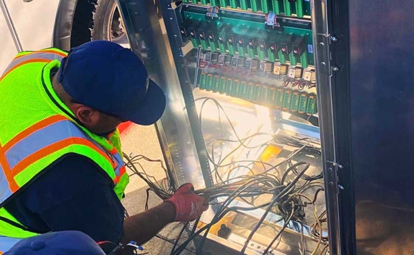 a worker working on an electric cabinet