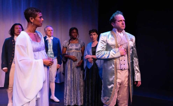 a queen and her king on stage