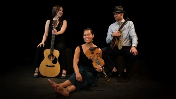 Three people with instruments