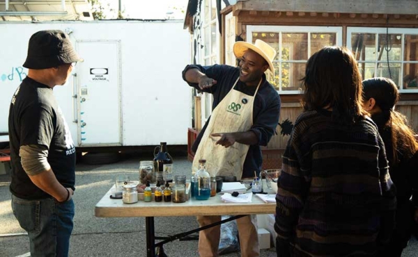 a man demonstrating to a group of people