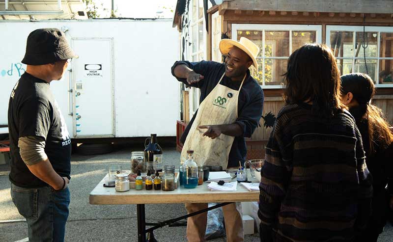 a man demonstrating to a group of people