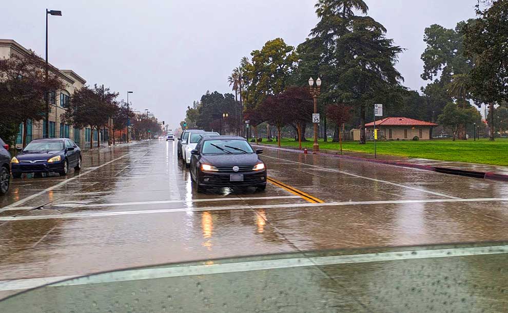 a cross street under the rain