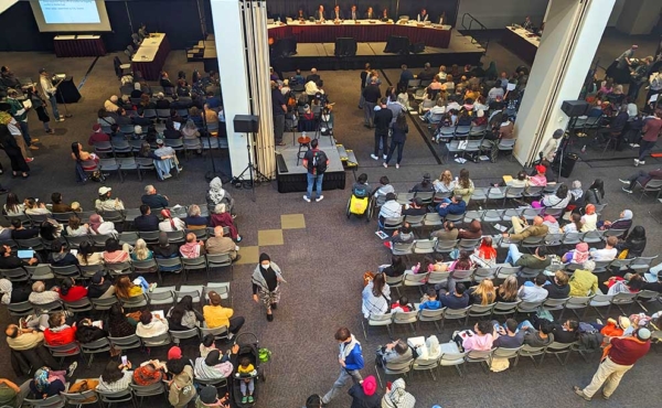 people gathering in a large room