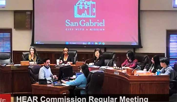 Commissioners sitting at dais