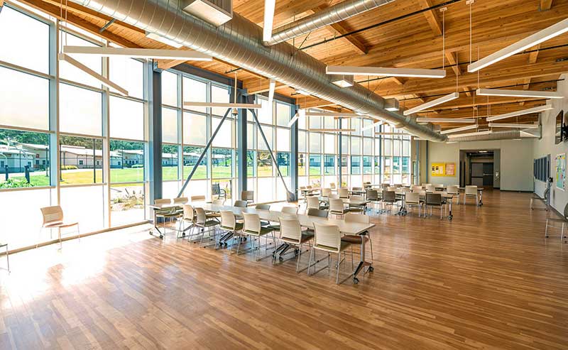 a waiting area hall with chairs