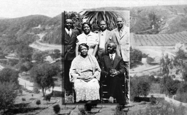 A black family posing for a photo