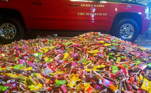 A firefighter truck near a pile of candy