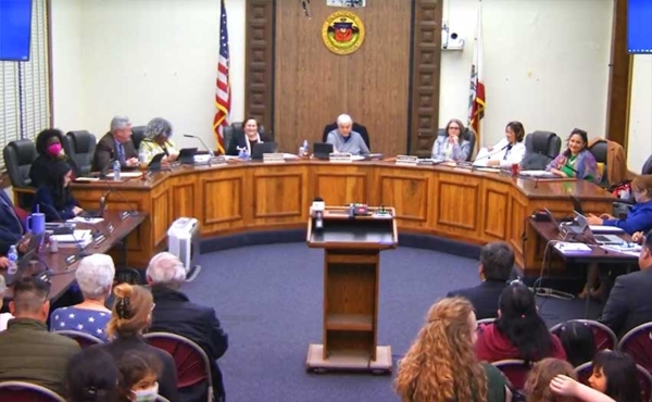 a group of people on dais and people attending