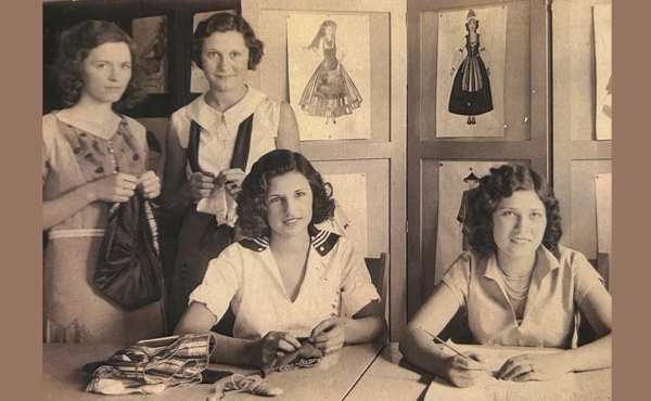 A historical photo of women sitting behind a desk