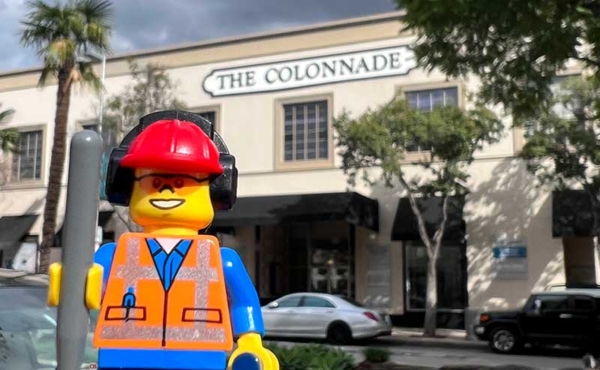 a toy character superimposed over an entrance of a shopping center