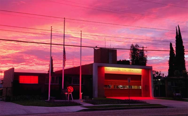 a fire station lit up in red