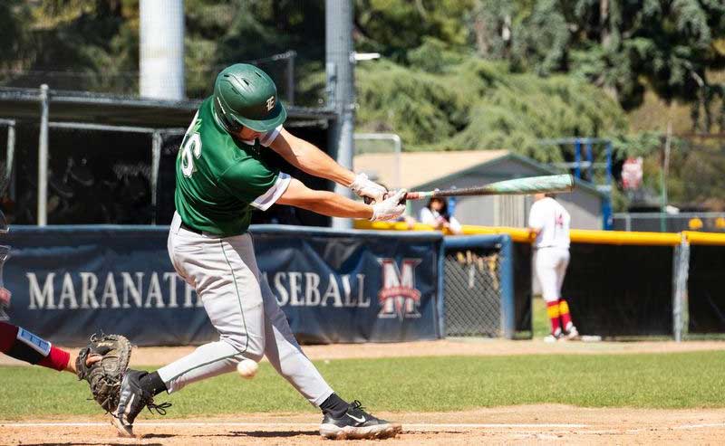 A player is batting on the field