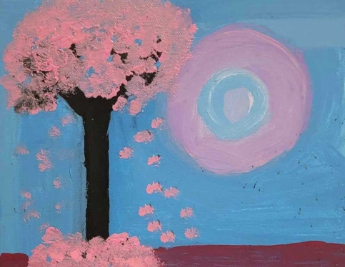 A blossoming cherry tree with sun