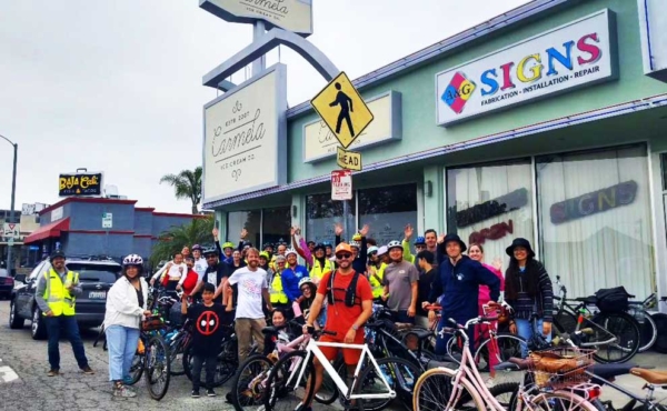 bicyclists in front of an ice cream shop