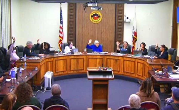 School board members taking a vote