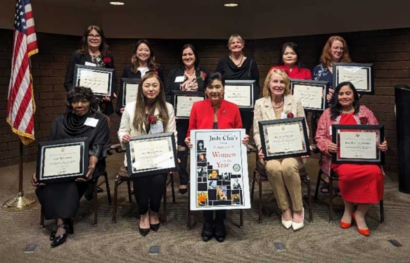 women surrounded by a U.S. Representative