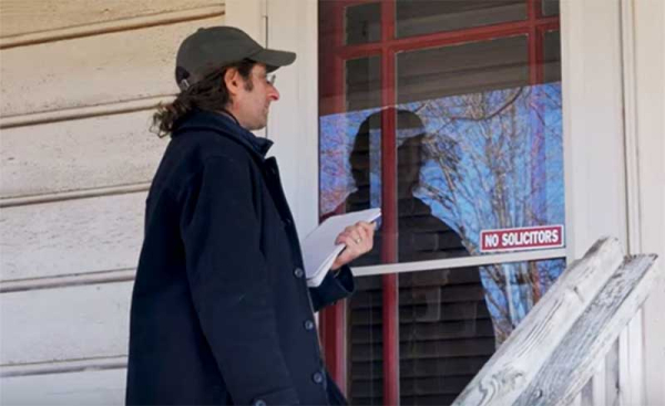 a man knocking on a door