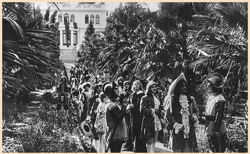 A group of actors in costumes from a movie scene