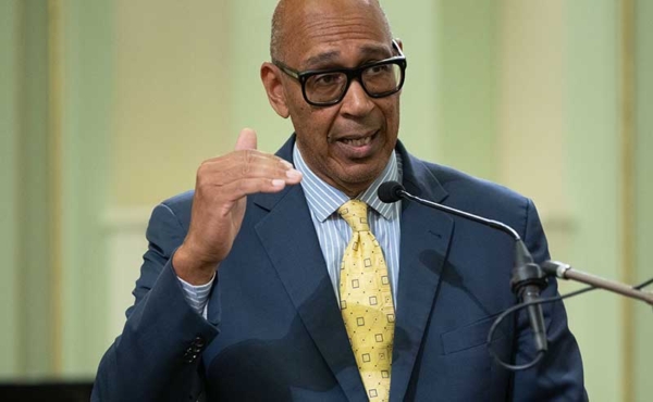 A person speaking to a microphone