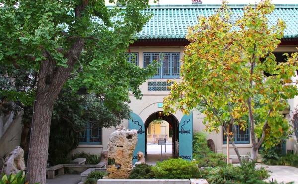 trees and a water pond at an entrance