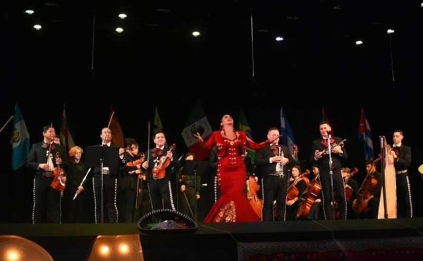 A Latin band on stage with costumes