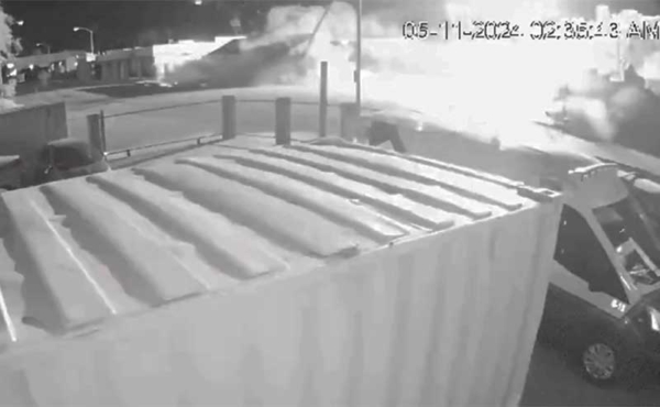 a car slamming into a pole with sparks