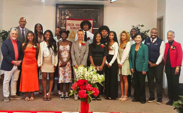 A group of people smiling for camera