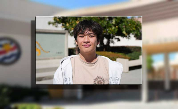 A kid smiling at canera