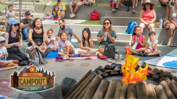 Families gathered around a fake fire