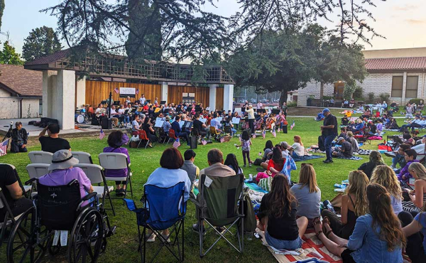 crowd gathers in a park