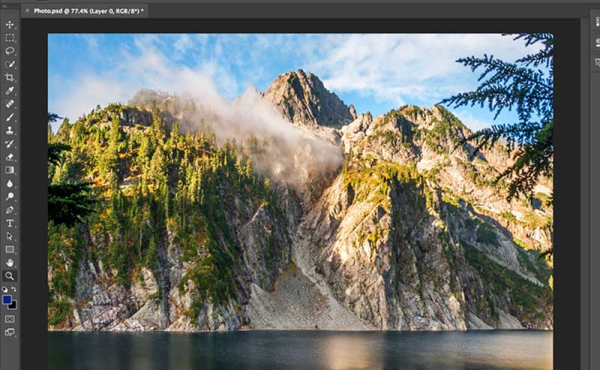 a screen photo of a mountain and a lake