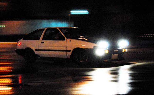 a car on a wet street at night