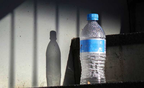 a bottle of water left standing in the sun