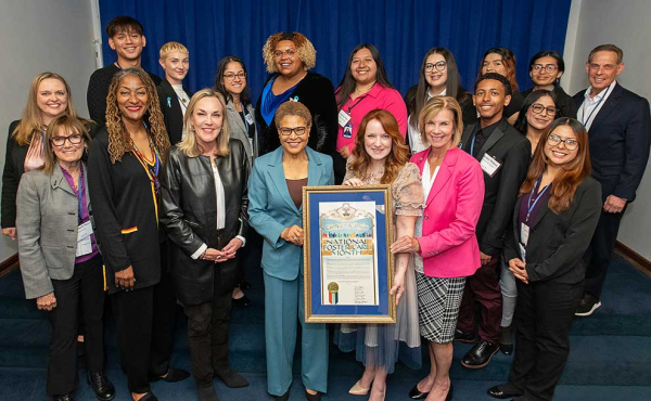 a group of people holding a proclamation