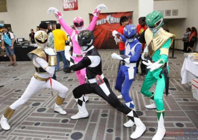 Five people in Power Ranger costumes